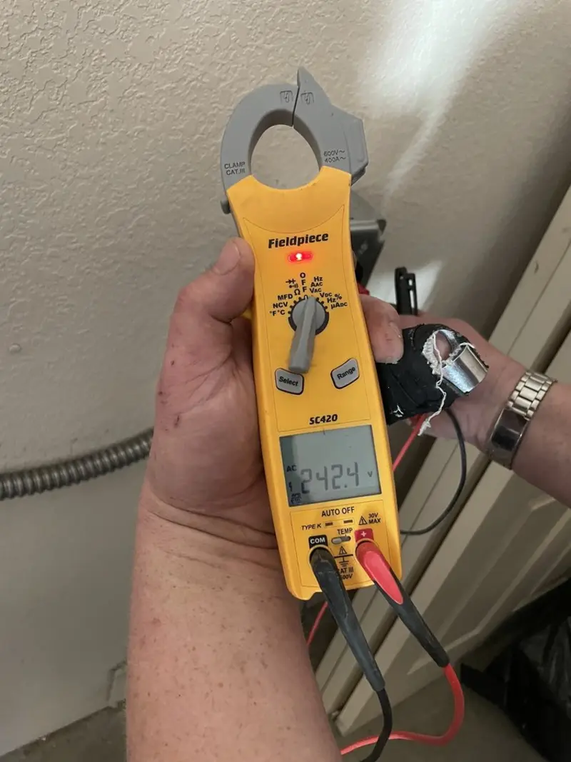 Voltage testing with clamp meter during Recessed Lighting Installation in Lincoln City